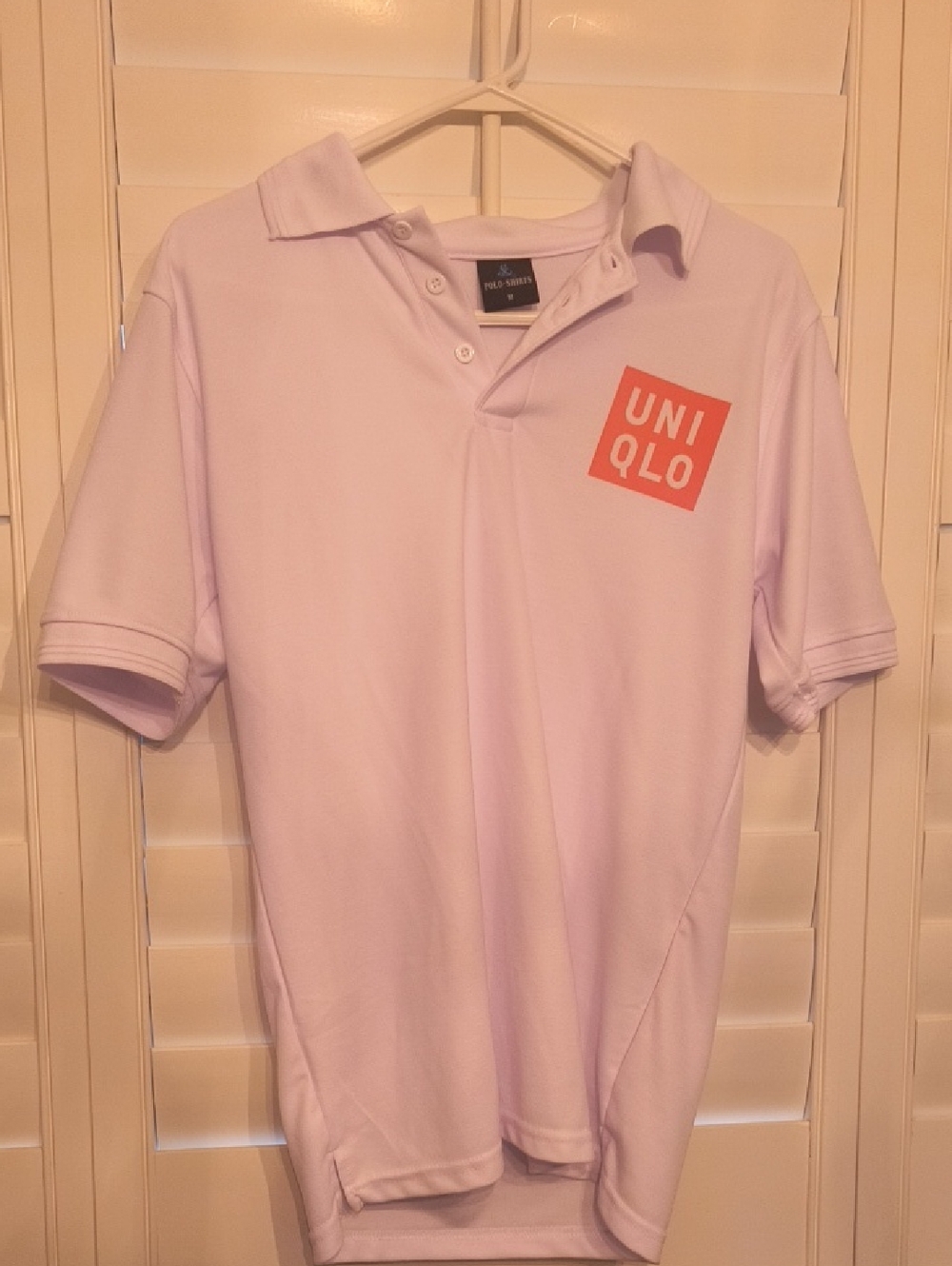 Uniqlo Men’s Light Lavender Polo with Orange Logo